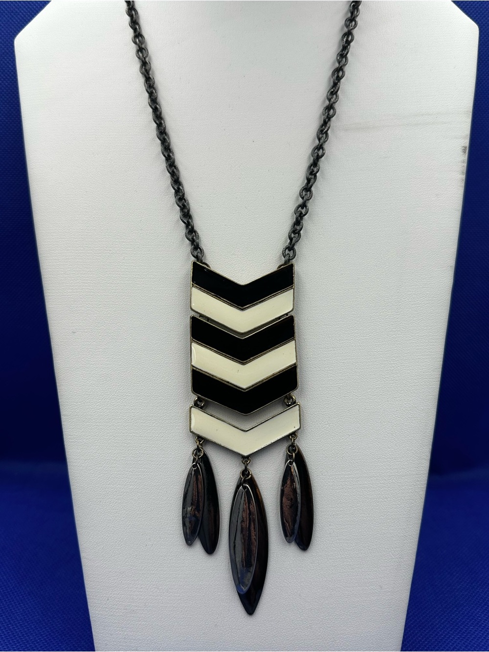 Gold Toned Trimmed Stacked Chevron Pendant Necklace with Teardrop Dangles